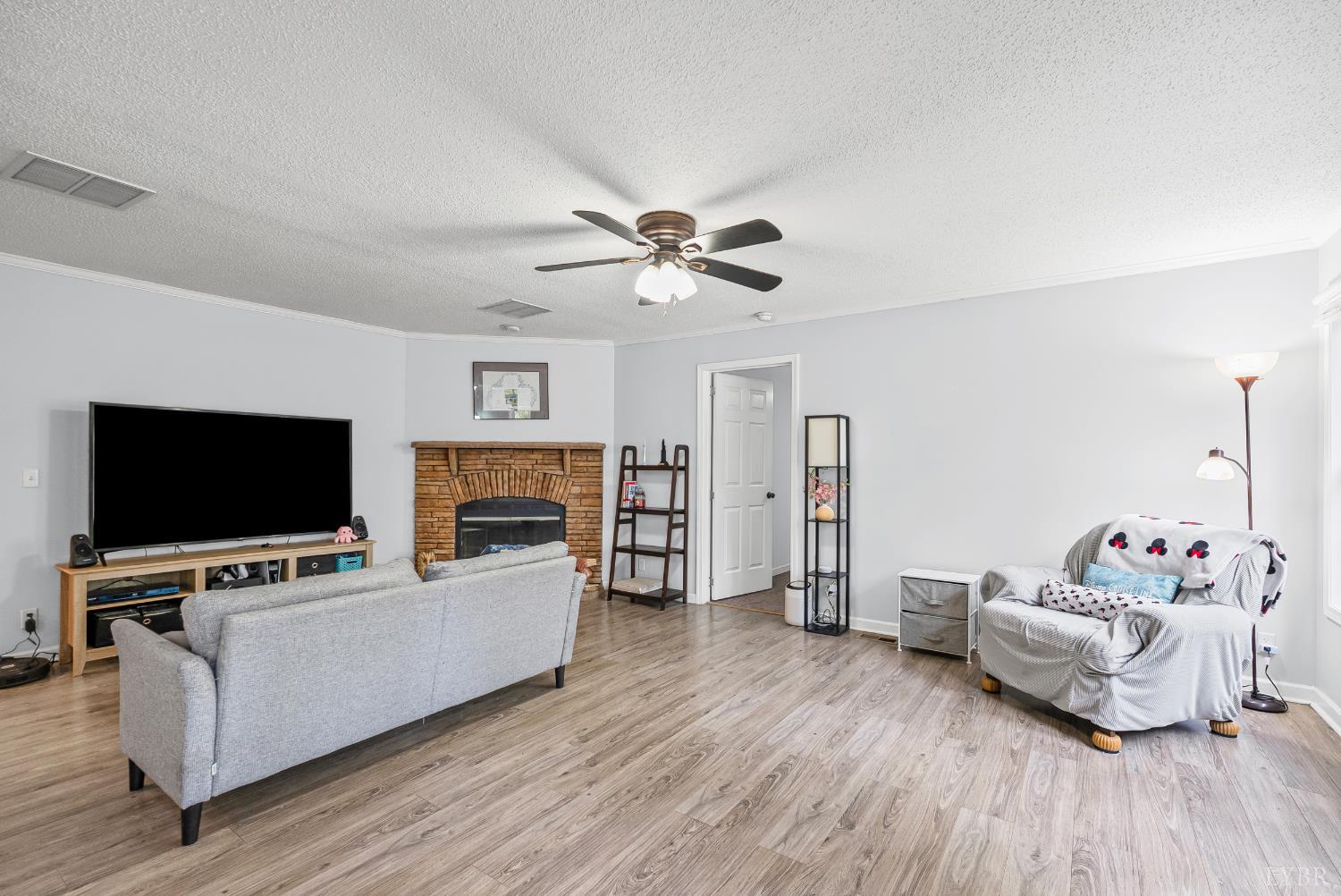 6124 Old Courthouse Road Appomattox, VA 24522 - Photo 2 of 52 a living room with furniture and a flat screen tv