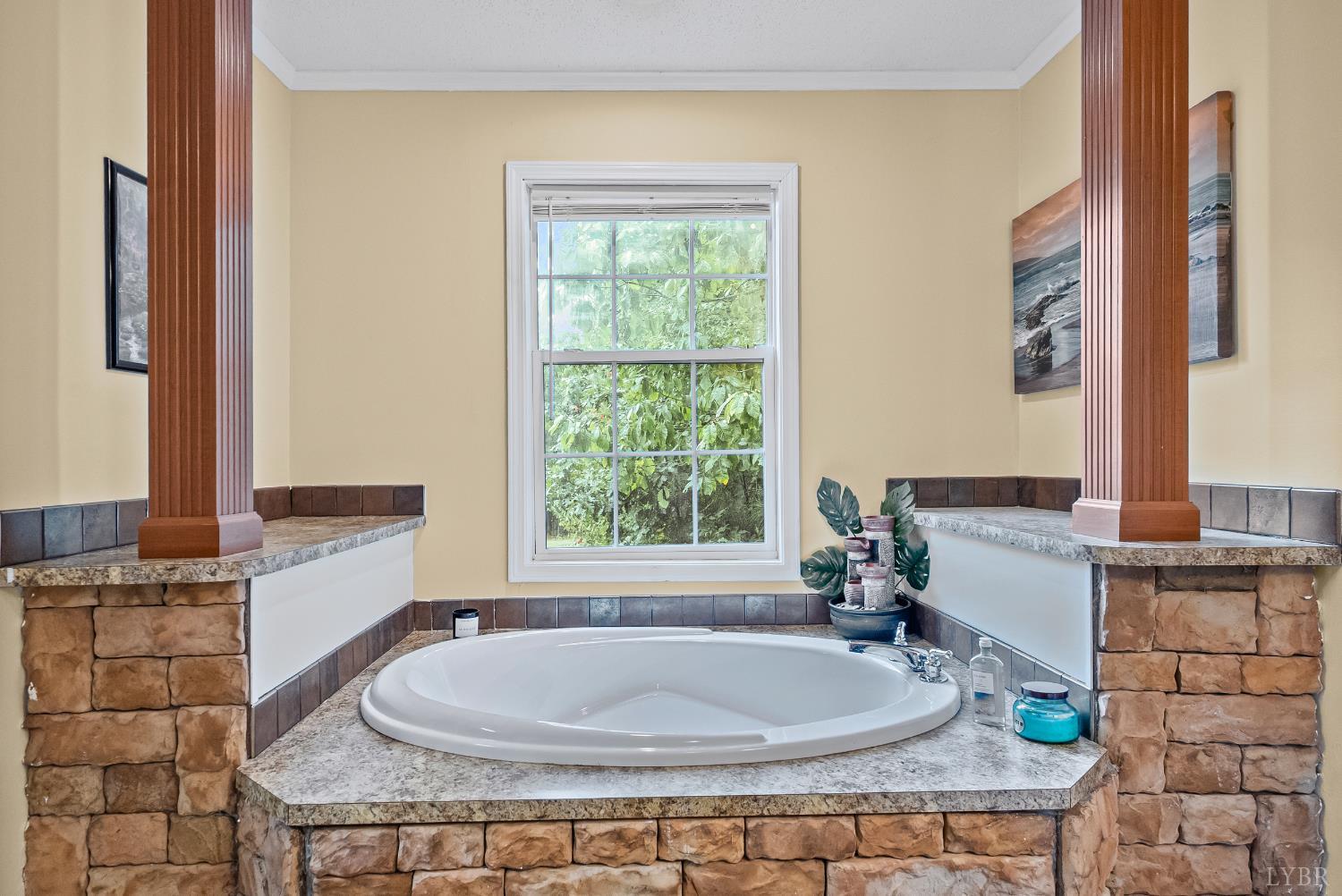 6124 Old Courthouse Road Appomattox, VA 24522 - Photo 21 of 52 a bathroom with a granite countertop sink and a bathtub