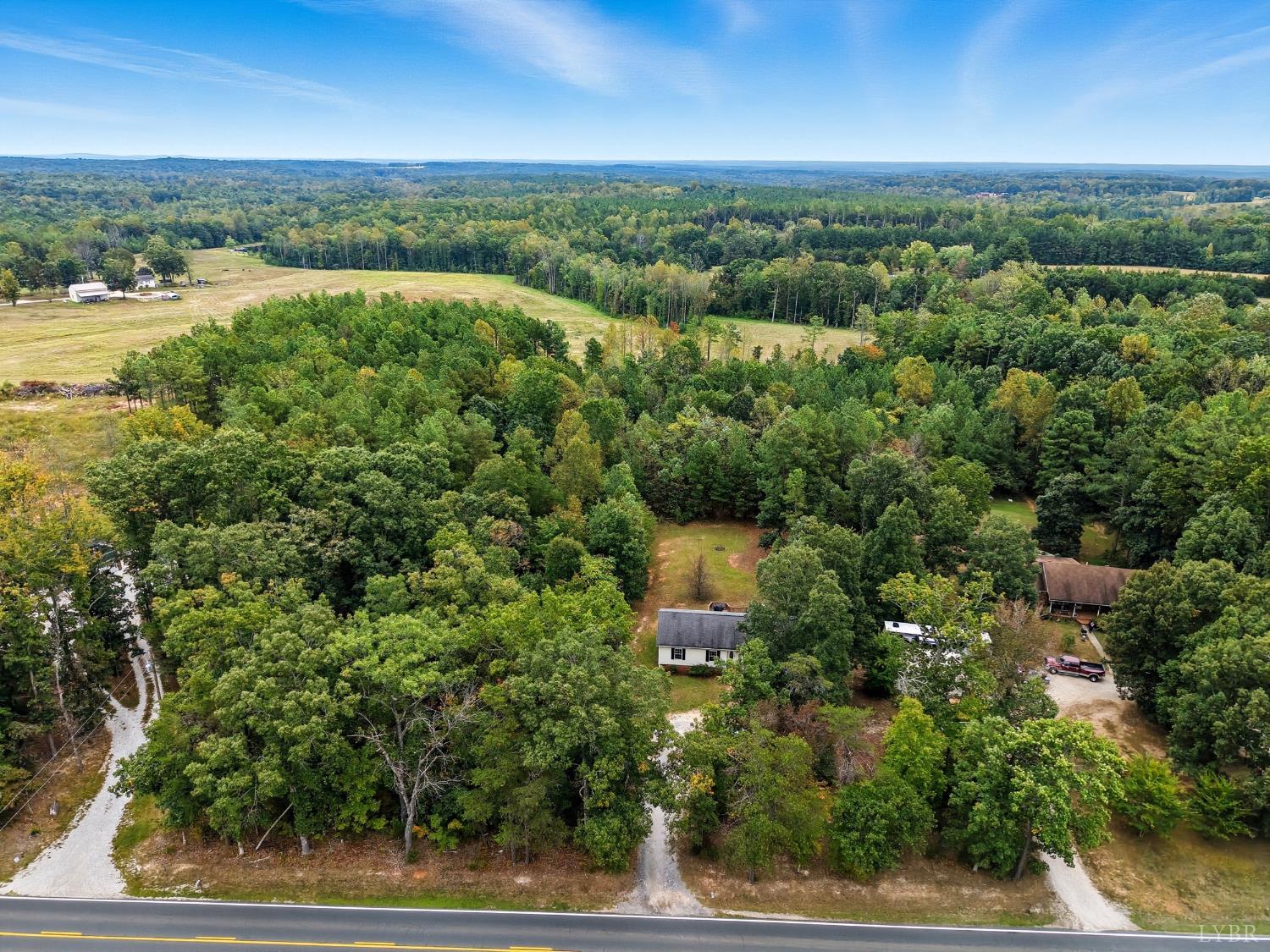 6124 Old Courthouse Road Appomattox, VA 24522 - Photo 44 of 52 an aerial view of a house with a yard and lake view