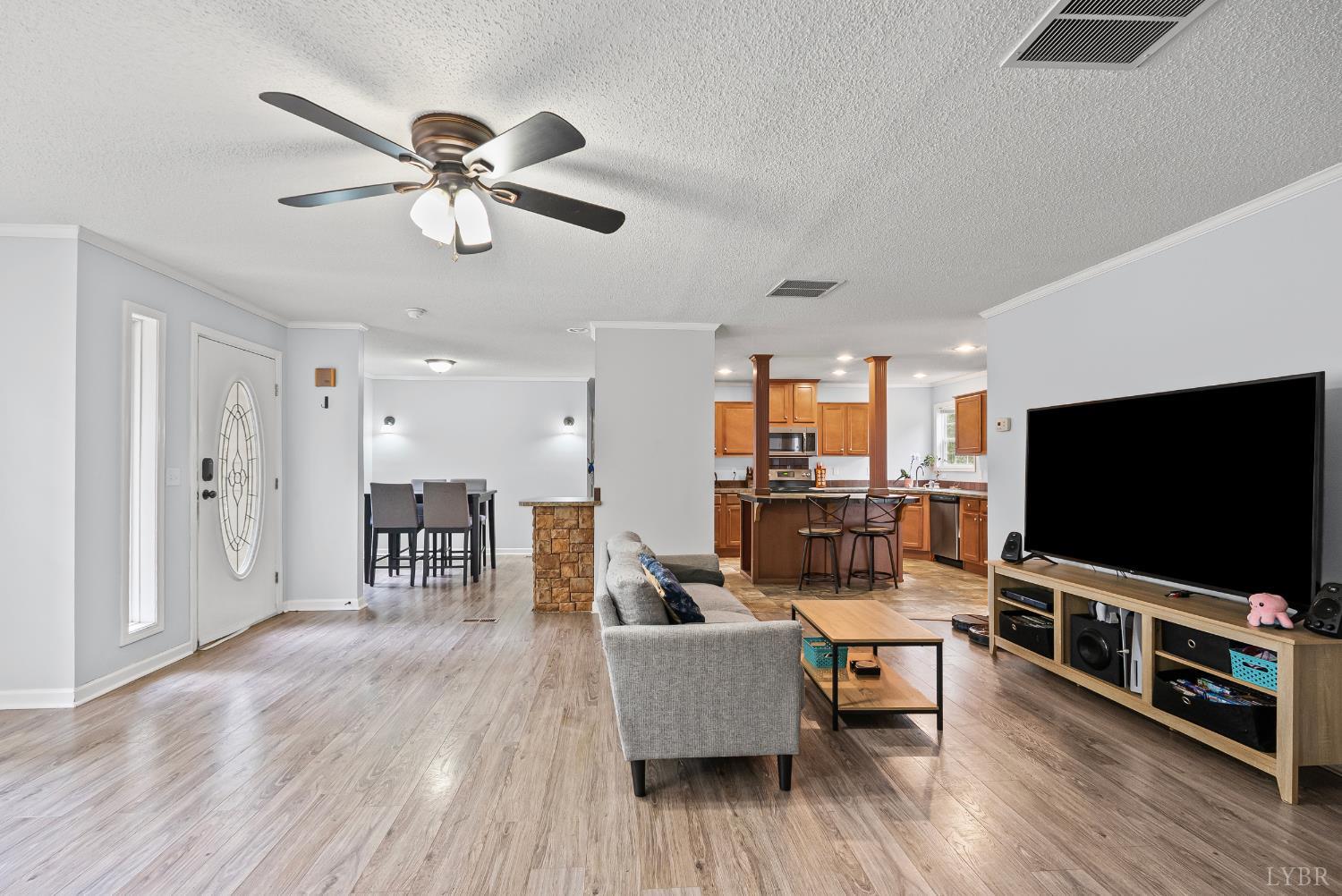 6124 Old Courthouse Road Appomattox, VA 24522 - Photo 8 of 52 a living room with furniture and a flat screen tv