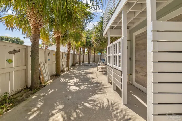 a balcony with furniture and a potted plant