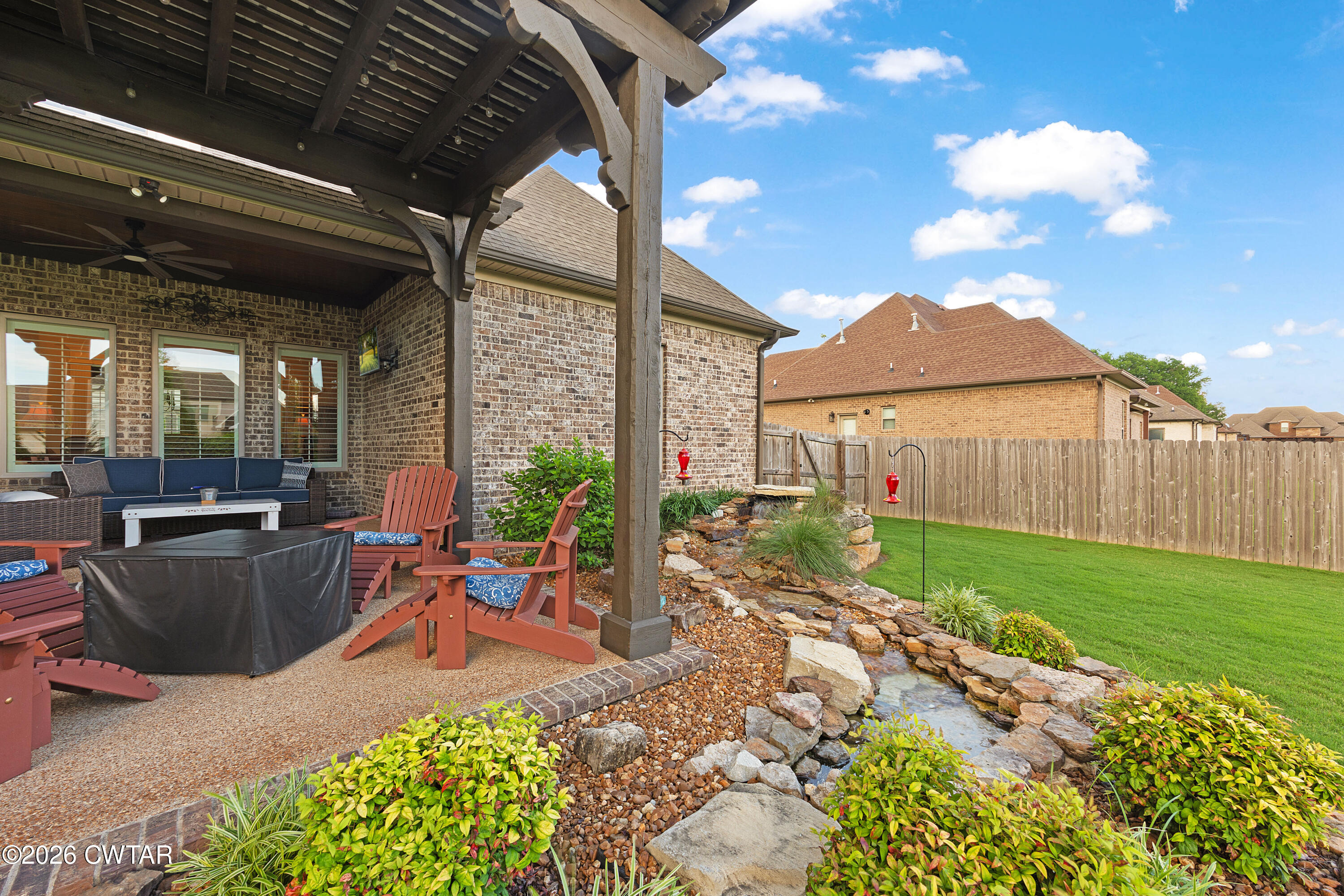 34 Cheddleton Cove Jackson, TN 38305 - Photo 27 of 32 a view of a backyard with garden and patio