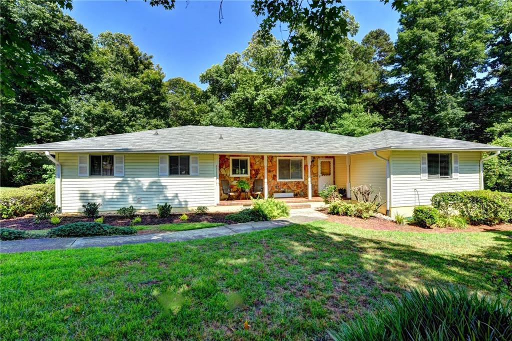 Front of home.  level walk, rocking chair front porch, happy inviting front door! 