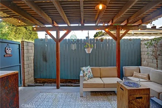 a building outdoor space with patio furniture and potted plants