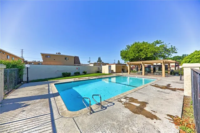 a view of a swimming pool with a lounge chairs
