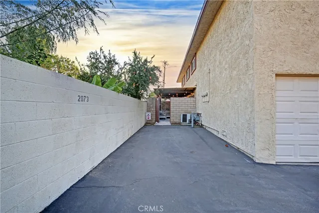 a view of a patio with table and chairs