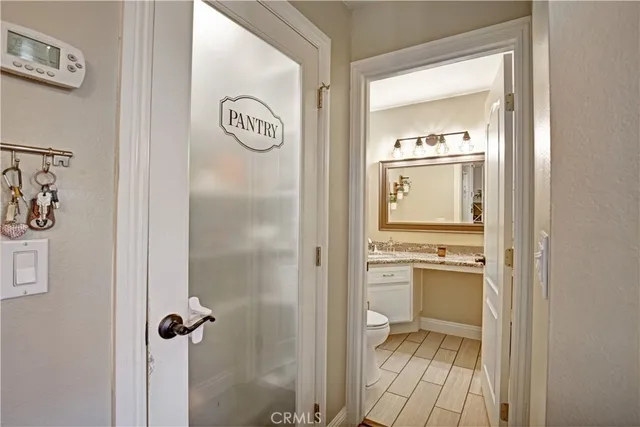 a bathroom with a granite countertop sink a mirror and a shower