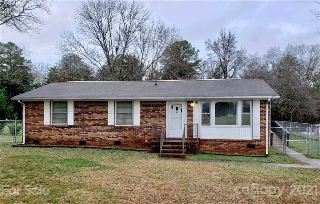 1521 Miles Road, Unit 5 Dallas, NC 28034 - Photo 1 of 1 a front view of a house with a garden