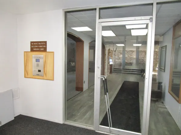 a bathroom with a glass shower door