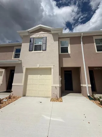 a front view of a house with yard