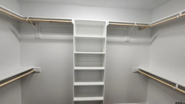 a view of an empty walk in closet