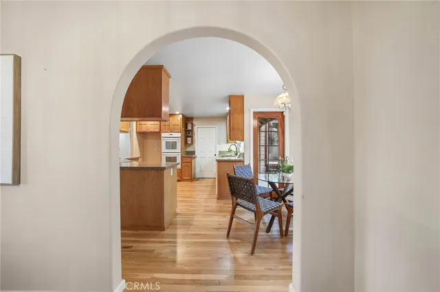 a kitchen with stainless steel appliances granite countertop a sink a counter space and cabinets