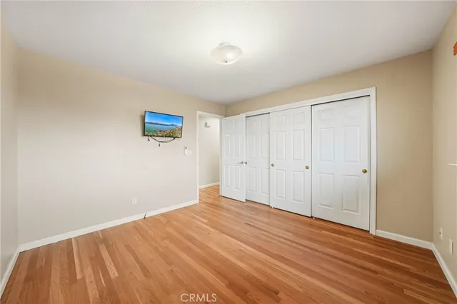 a kitchen with stainless steel appliances a refrigerator and wooden cabinets