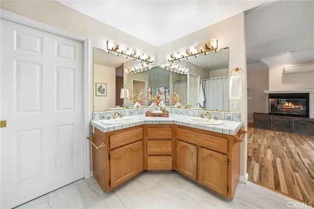 an empty room with windows and ceiling fan