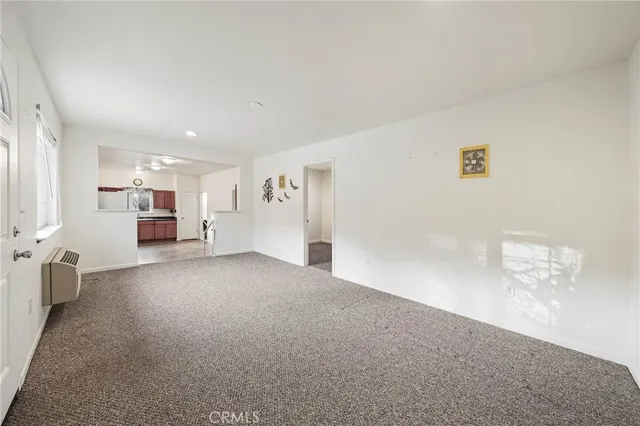 a backyard of a house with a barn and large tree