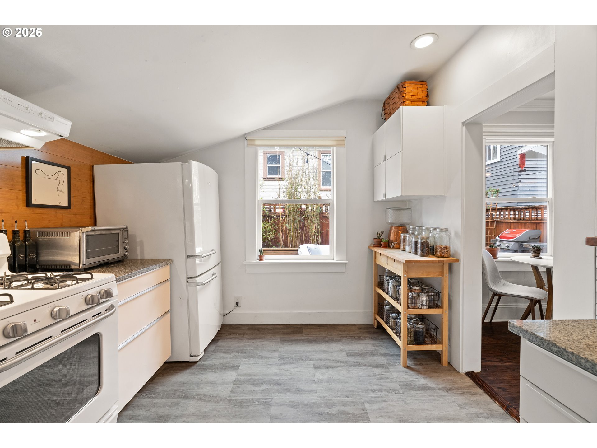 3017 South Water Avenue Portland, OR 97201 - Photo 11 of 31 a kitchen with a stove a sink and a refrigerator