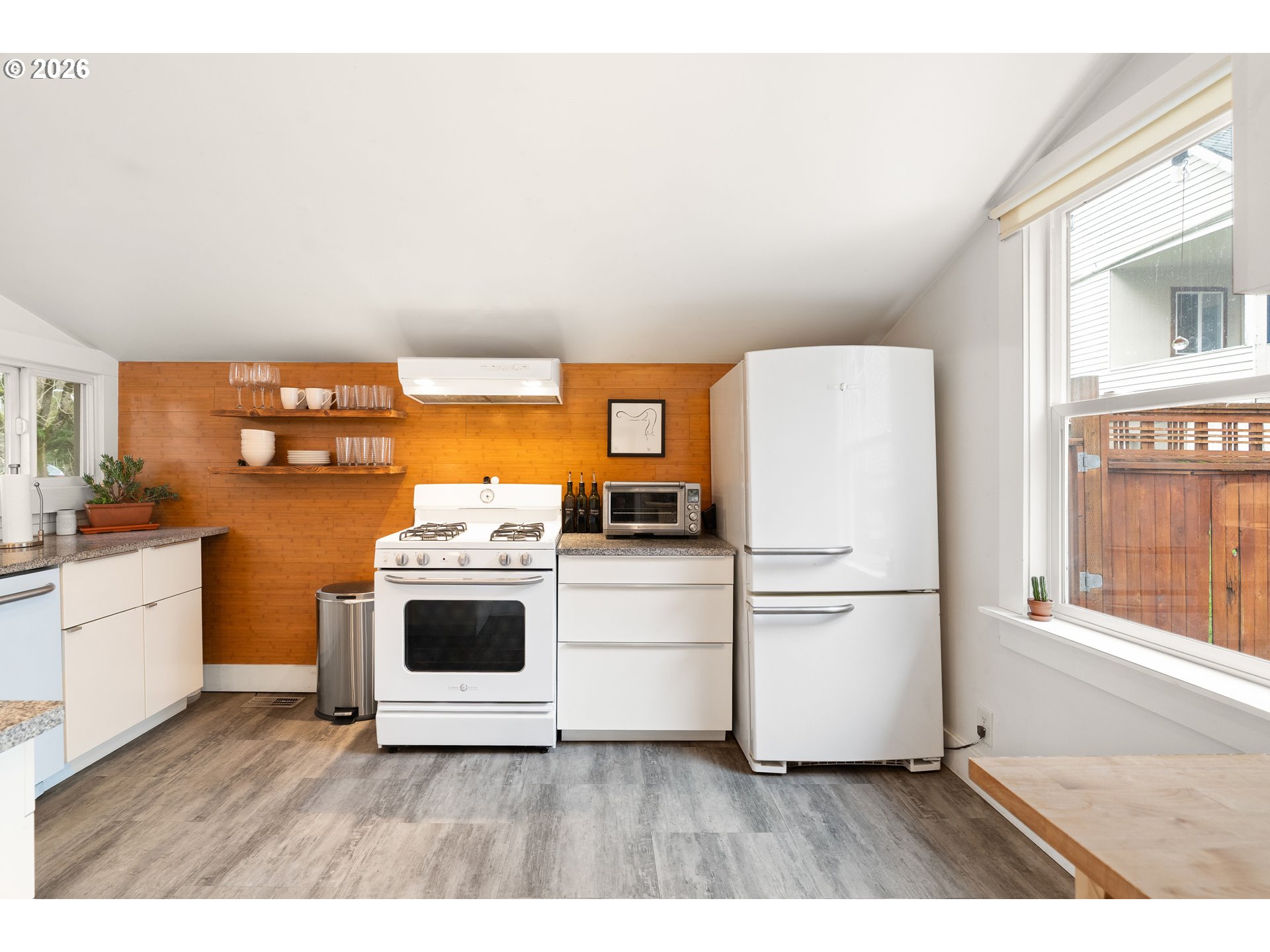 3017 South Water Avenue Portland, OR 97201 - Photo 12 of 31 a kitchen with stainless steel appliances a refrigerator sink and stove