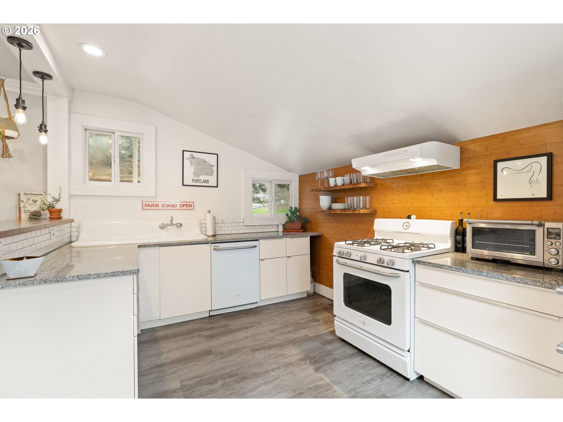 3017 South Water Avenue Portland, OR 97201 - Photo 13 of 31 a kitchen with stainless steel appliances granite countertop a stove and a sink