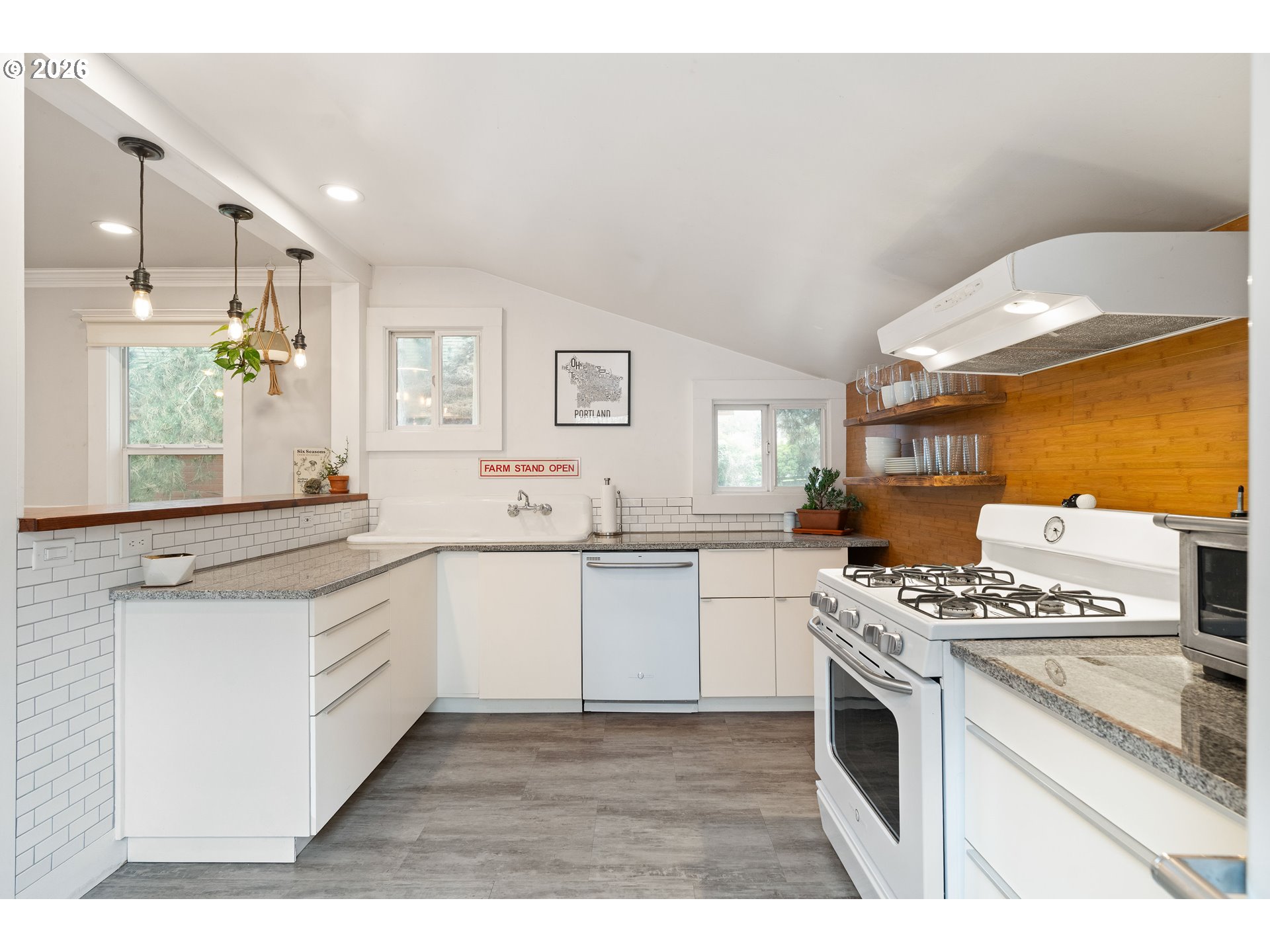 3017 South Water Avenue Portland, OR 97201 - Photo 14 of 31 a kitchen with stainless steel appliances granite countertop a stove a sink and a granite counter tops