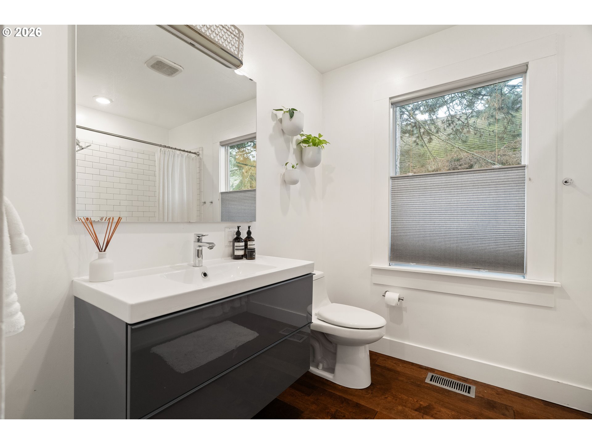 3017 South Water Avenue Portland, OR 97201 - Photo 17 of 31 a bathroom with a sink toilet and a mirror
