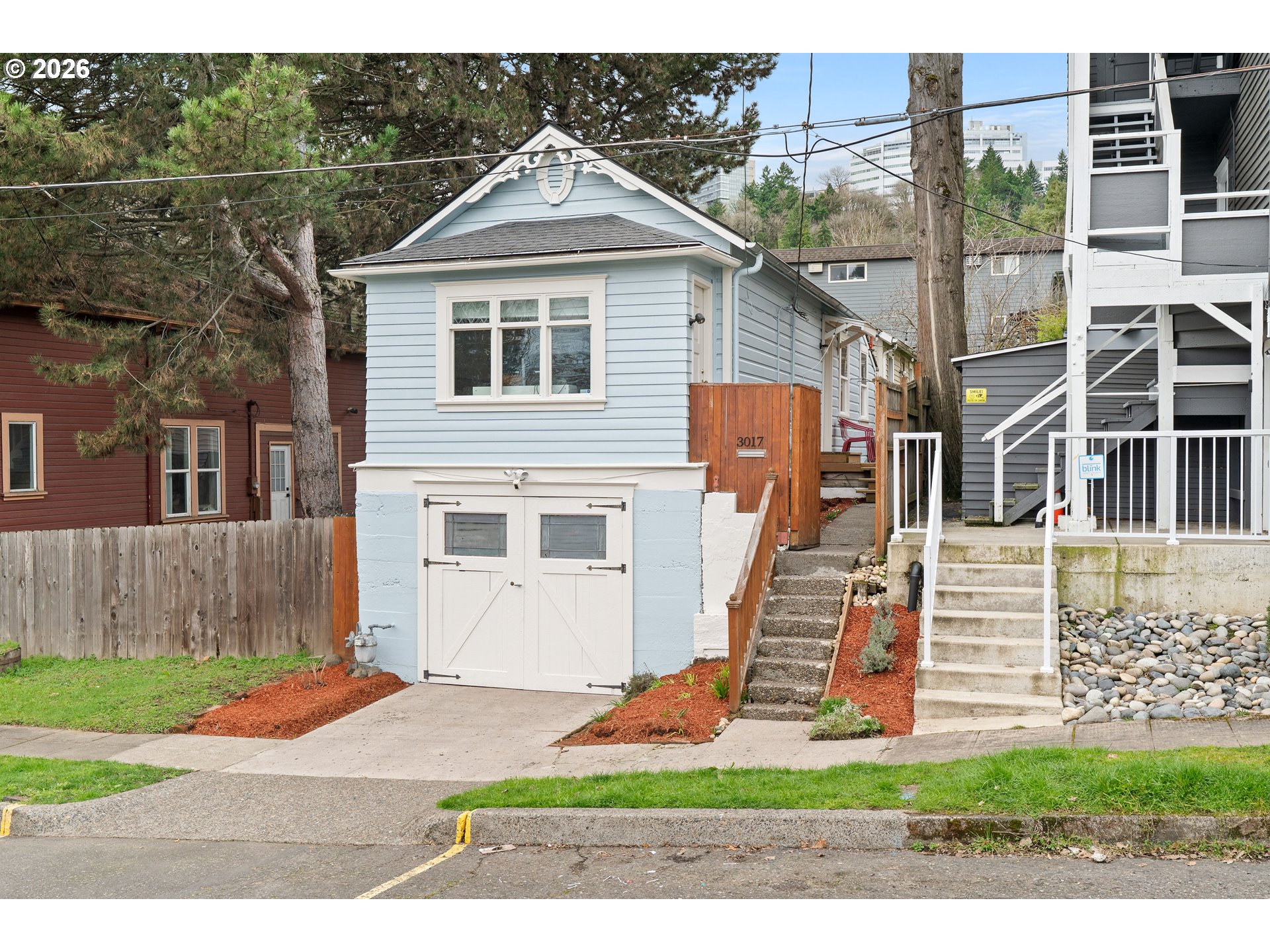 3017 South Water Avenue Portland, OR 97201 - Photo 2 of 31 a front view of a house with a yard