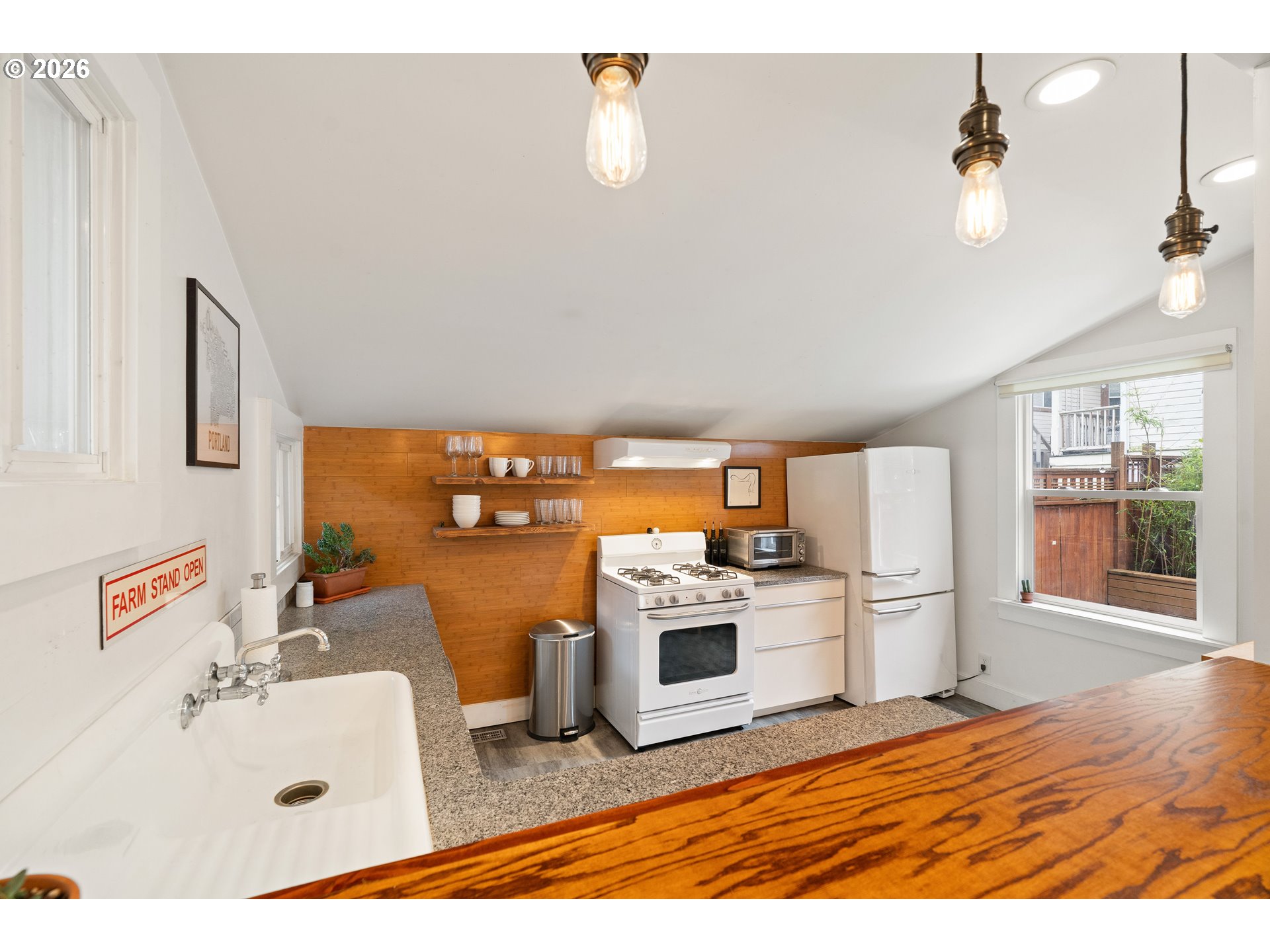 3017 South Water Avenue Portland, OR 97201 - Photo 9 of 31 a kitchen with stainless steel appliances a stove a sink and a refrigerator