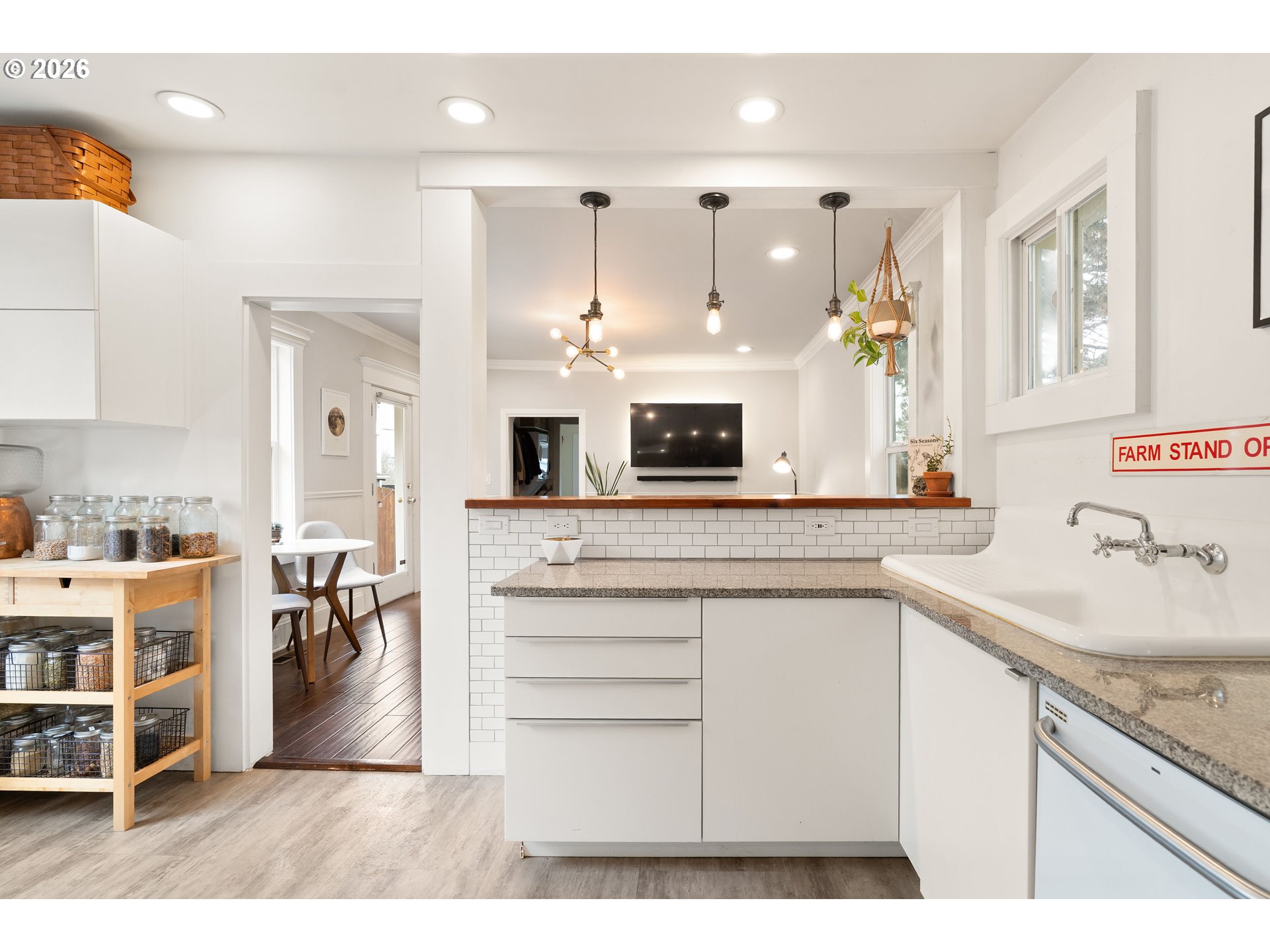 3017 South Water Avenue Portland, OR 97201 - Photo 10 of 31 a kitchen with cabinets and wooden floor
