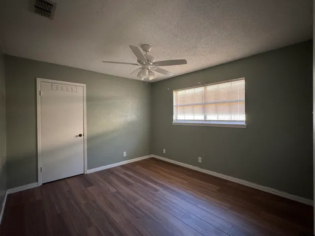 a bathroom with a bath tub with a window