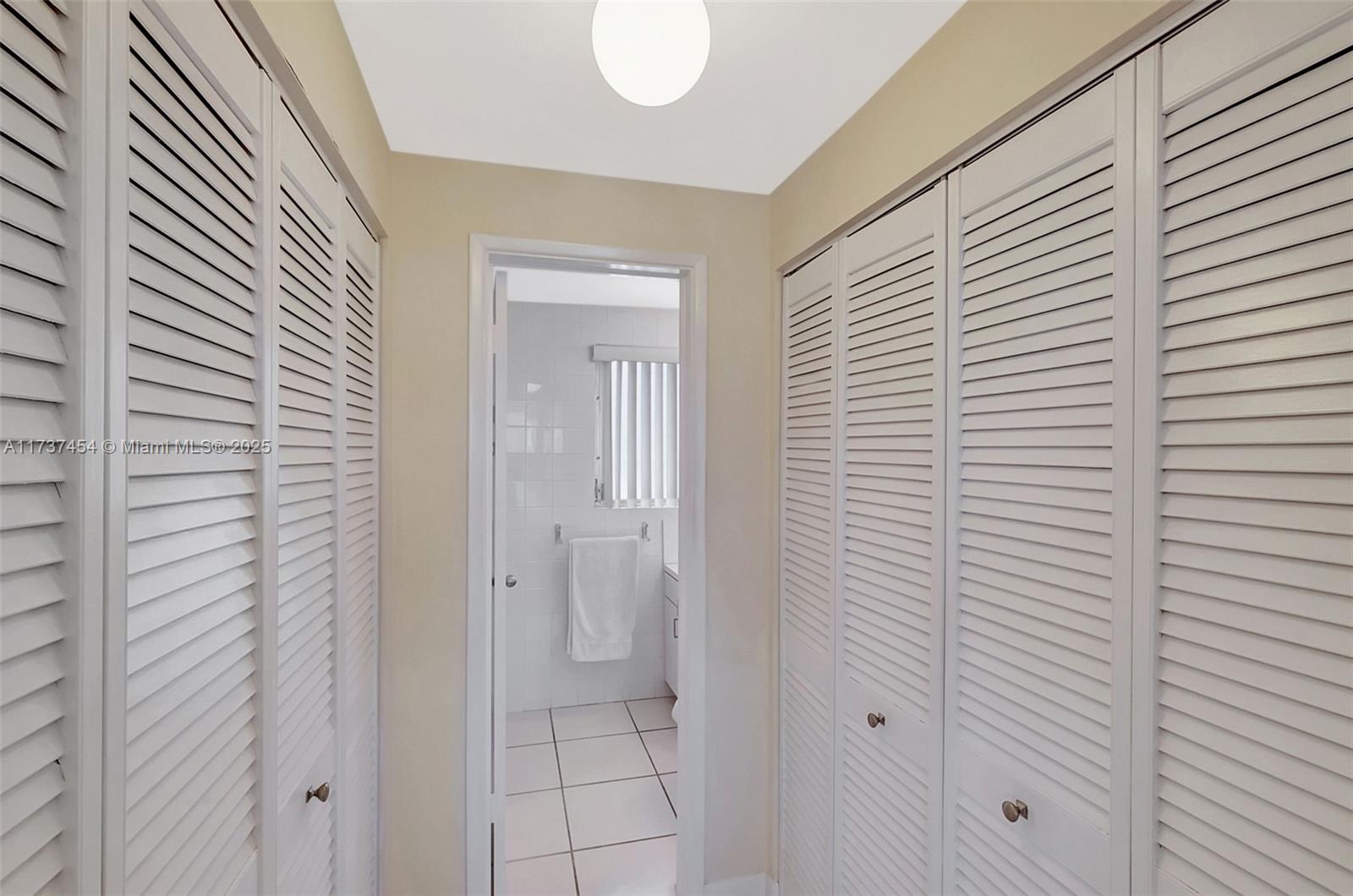 1155 103rd Street, Unit 9B Bay Harbor Islands, FL 33154 - Photo 22 of 43 a view of bathroom with shower