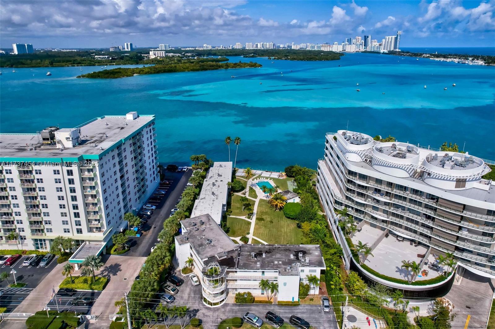 1155 103rd Street, Unit 9B Bay Harbor Islands, FL 33154 - Photo 29 of 43 aerial view of a city with lots of residential buildings and lake view