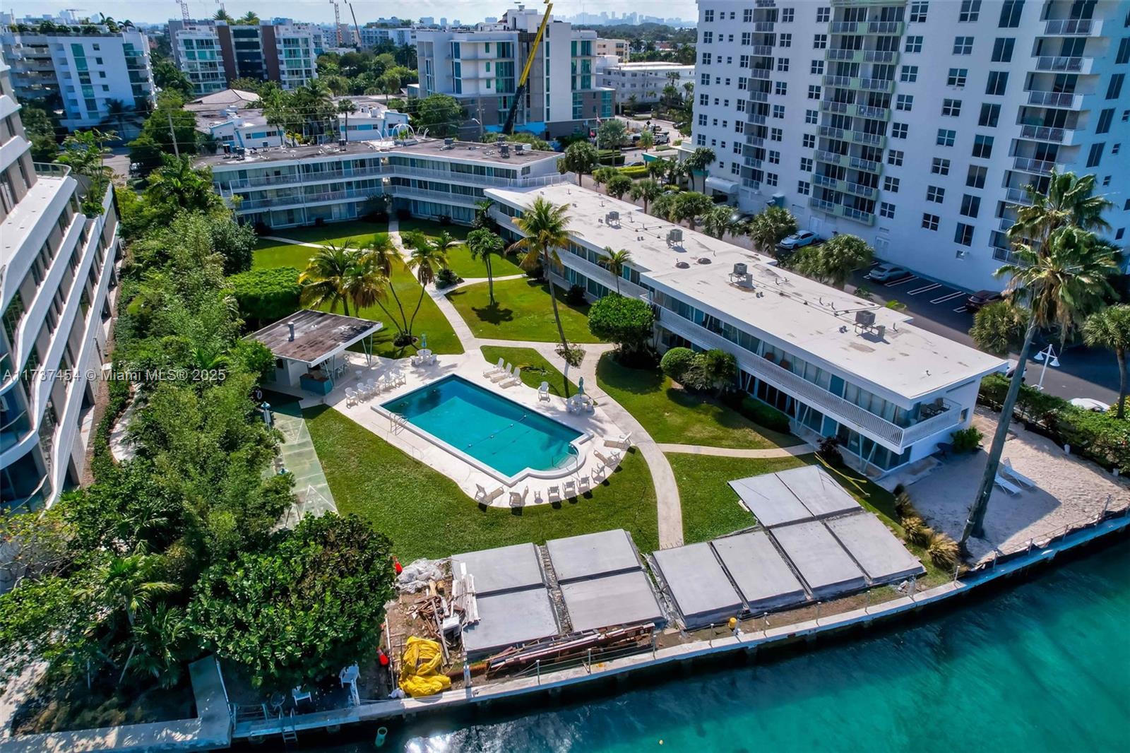 1155 103rd Street, Unit 9B Bay Harbor Islands, FL 33154 - Photo 38 of 43 an aerial view of a house with a swimming pool patio and outdoor seating