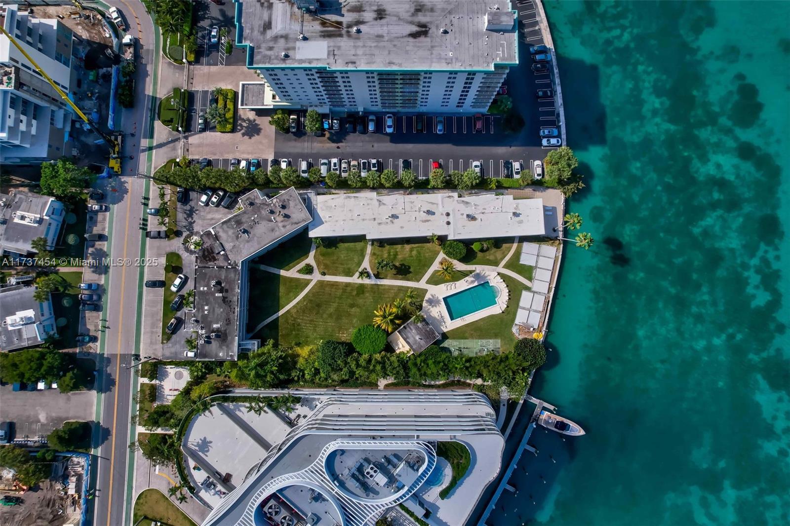 1155 103rd Street, Unit 9B Bay Harbor Islands, FL 33154 - Photo 40 of 43 an aerial view of residential house with outdoor space and parking