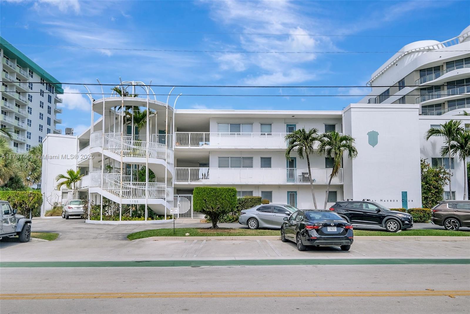 1155 103rd Street, Unit 9B Bay Harbor Islands, FL 33154 - Photo 43 of 43 a front view of a house with a garden