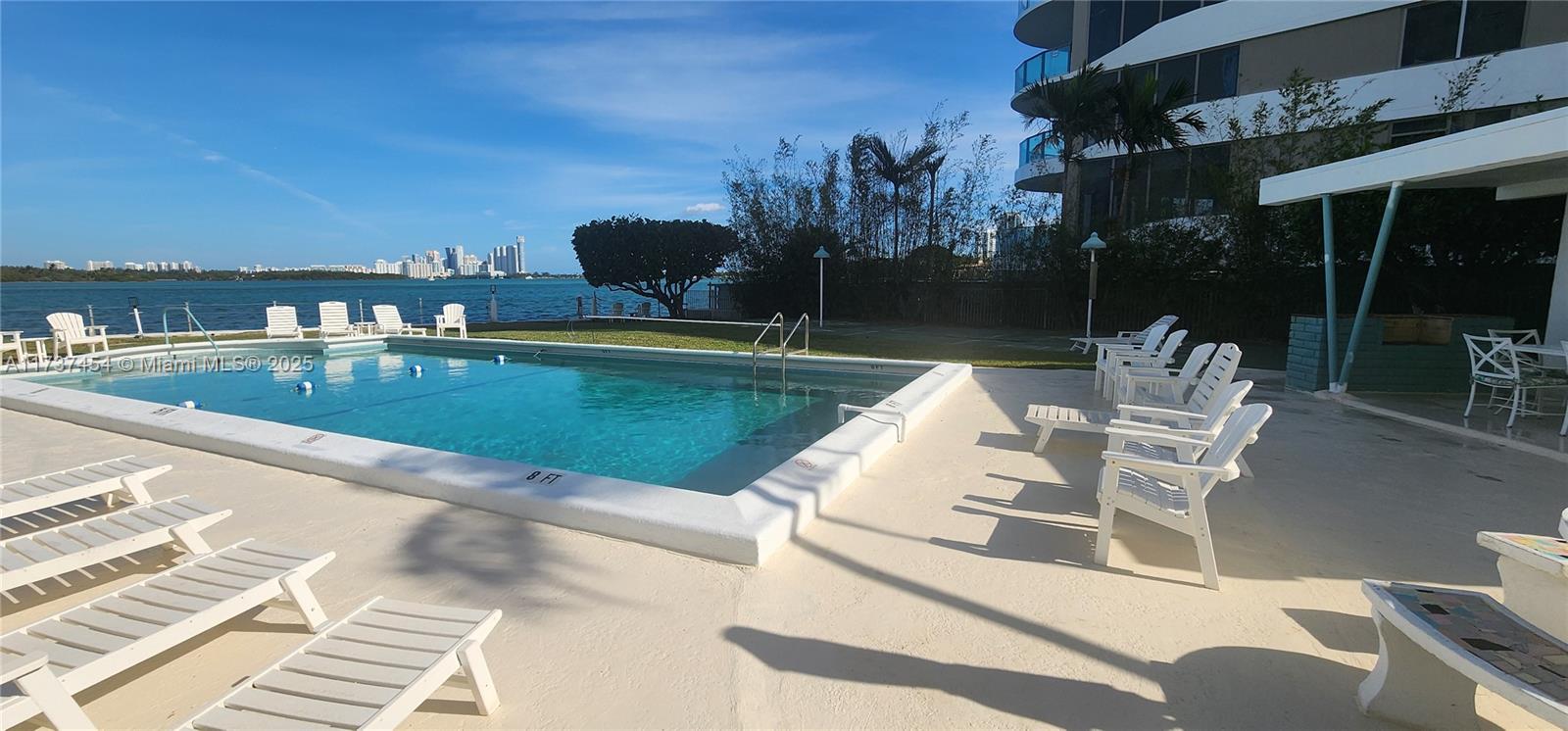 1155 103rd Street, Unit 9B Bay Harbor Islands, FL 33154 - Photo 8 of 43 a view of a patio with swimming pool