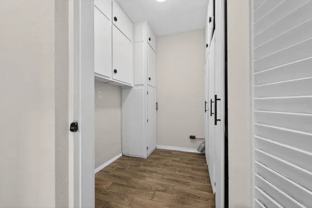 an empty room with a empty space and windows