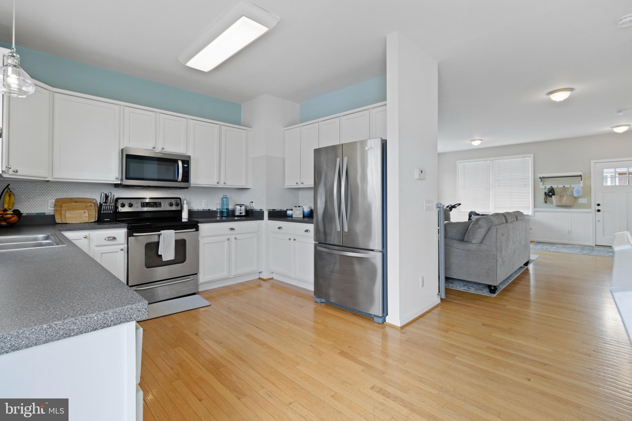 1615 Oldtown Road Edgewater, MD 21037 - Photo 13 of 35 a kitchen with granite countertop a refrigerator a stove top oven a sink and dishwasher