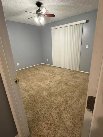 a bathroom with a toilet a sink a shower and a mirror