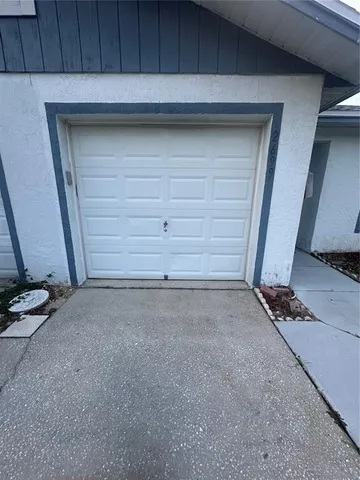 a view of room with stairs and a stove