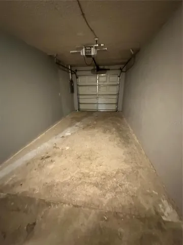 a view of a backyard with a small cabin and a chair