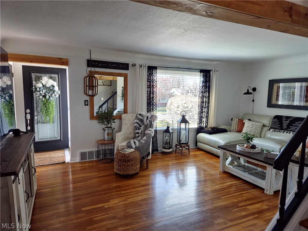 1681 Rush Road Wickliffe, OH 44092 - Photo 8 of 33 Living room with hardwood / wood-style floors and a textured ceiling