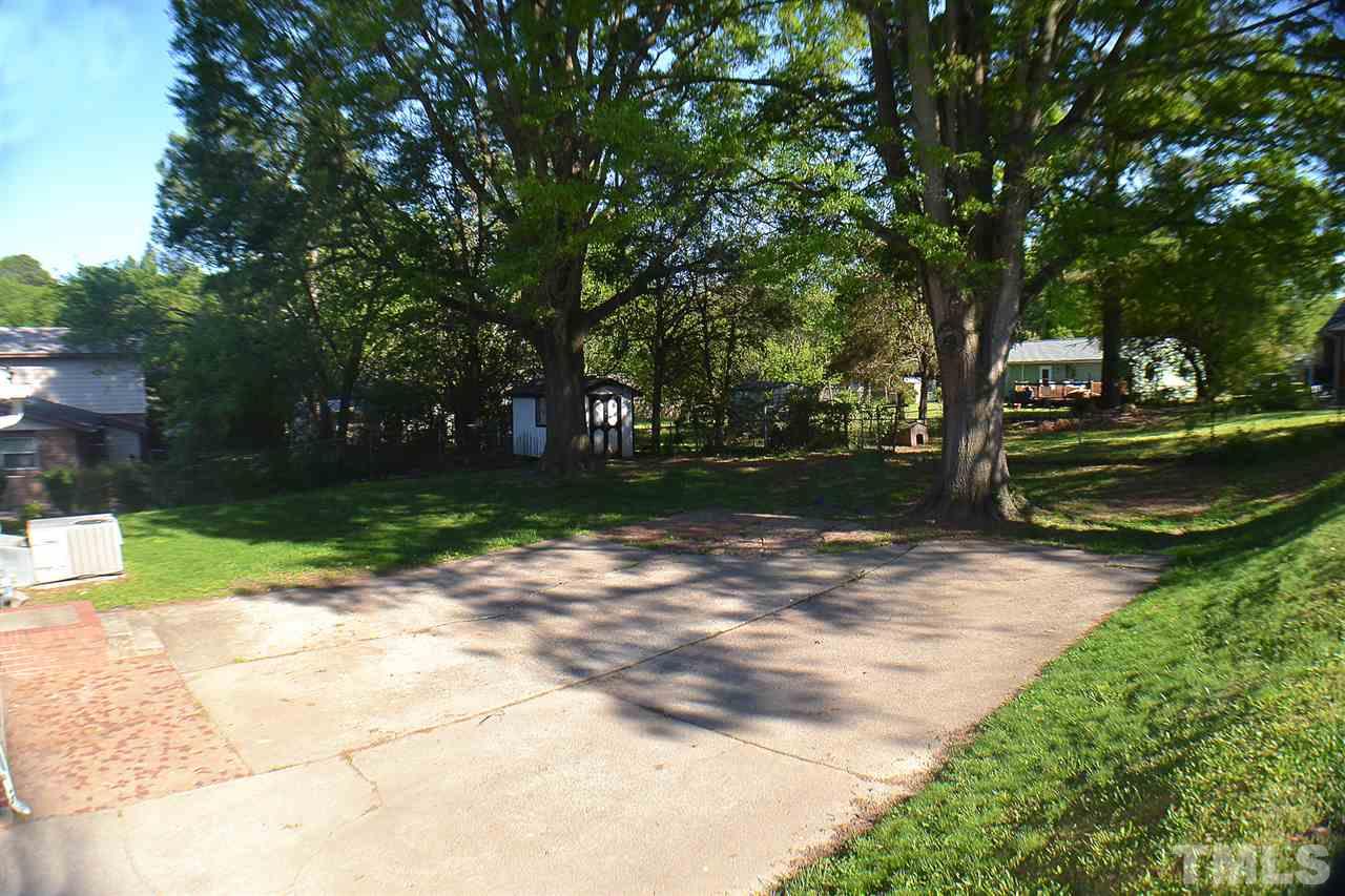 856 Hadley Road Raleigh, NC 27610 - Photo 11 of 13 a view of a yard with plants and trees