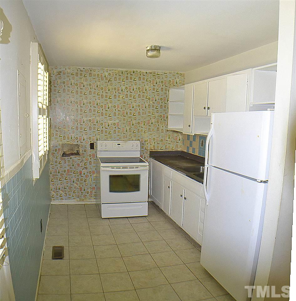 856 Hadley Road Raleigh, NC 27610 - Photo 5 of 13 a white refrigerator freezer sitting inside of a kitchen