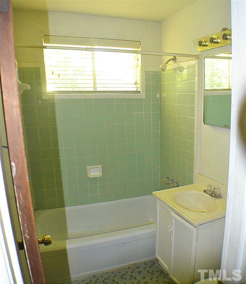 856 Hadley Road Raleigh, NC 27610 - Photo 7 of 13 a bathroom with a shower and a sink