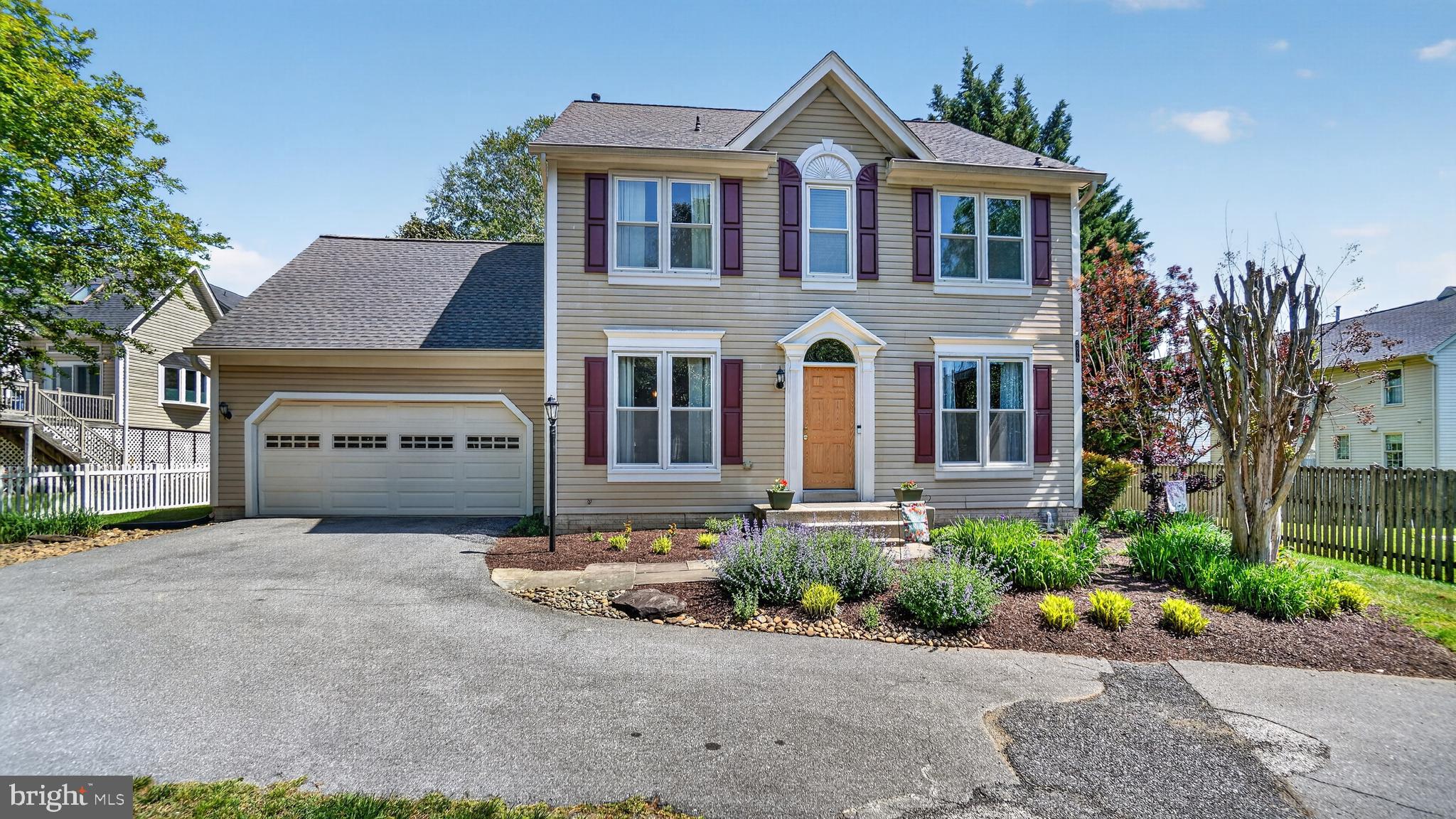 2812 Brite Court Crofton, MD 21114 - Photo 1 of 55 a front view of a house with a yard