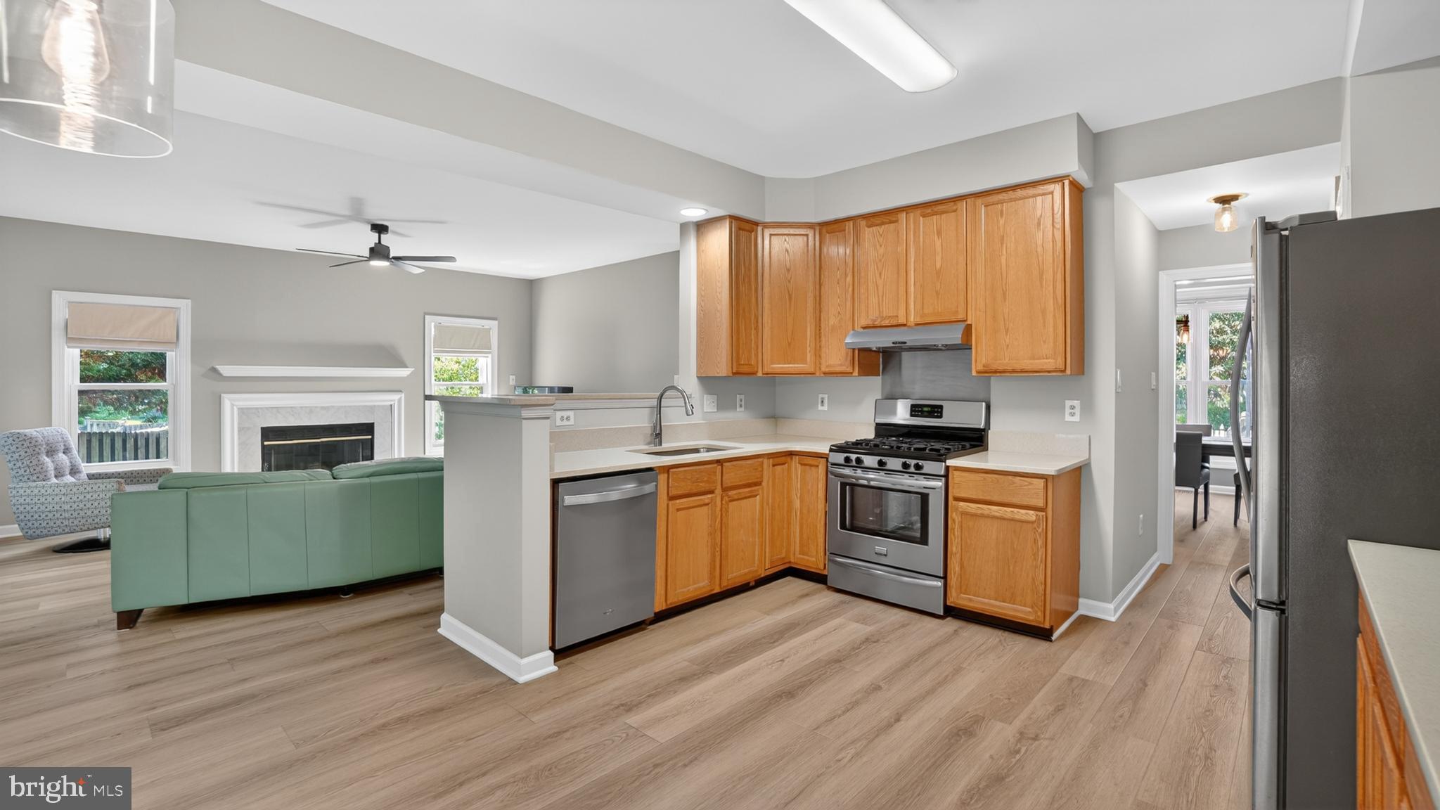 2812 Brite Court Crofton, MD 21114 - Photo 17 of 55 a kitchen with a refrigerator and a stove top oven