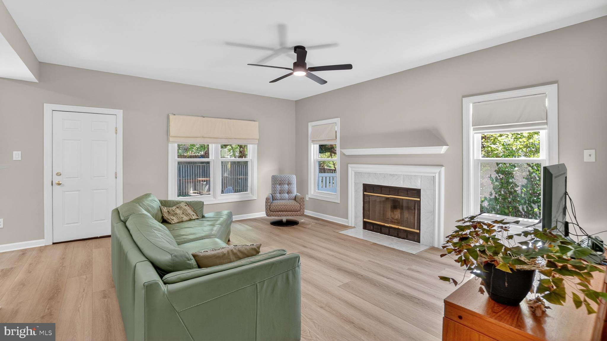 2812 Brite Court Crofton, MD 21114 - Photo 18 of 55 a living room with furniture fireplace and potted plant