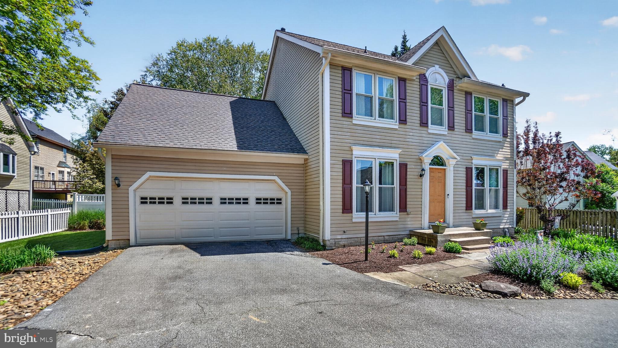 2812 Brite Court Crofton, MD 21114 - Photo 2 of 55 a front view of a house with a yard and garage