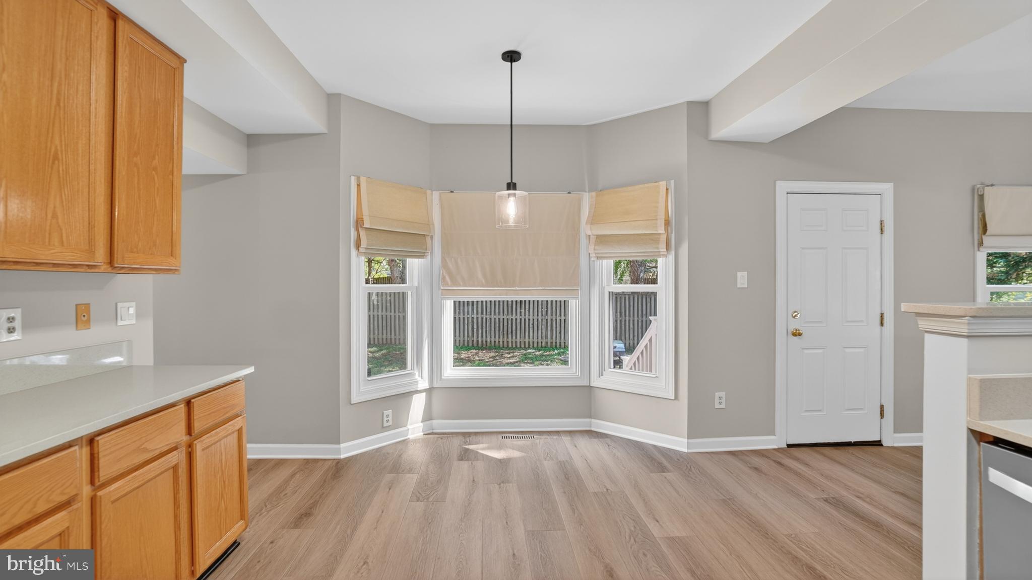 2812 Brite Court Crofton, MD 21114 - Photo 22 of 55 a view of an empty room with window and wooden floor