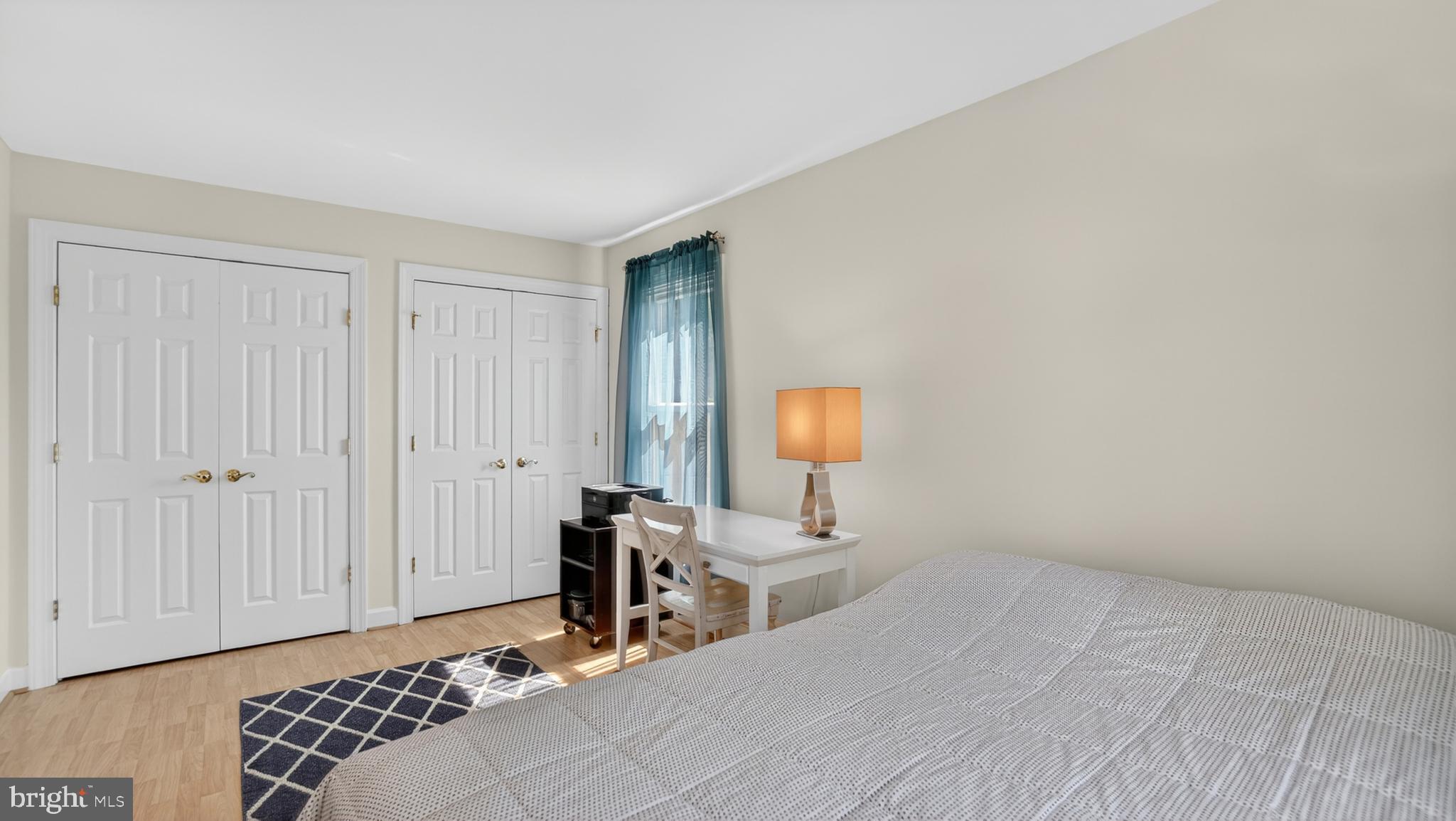 2812 Brite Court Crofton, MD 21114 - Photo 35 of 55 a bedroom with a bed and a lamp