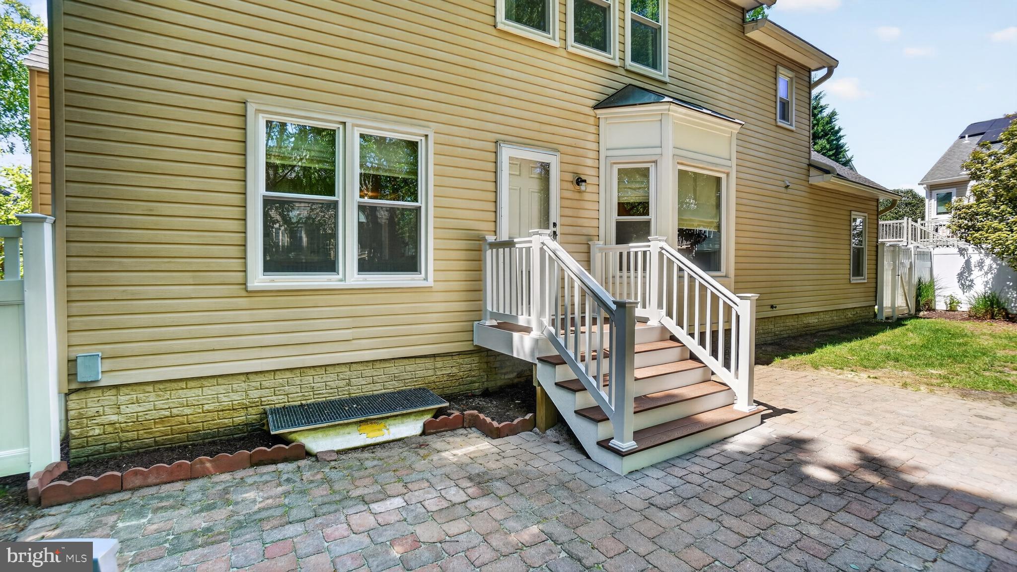 2812 Brite Court Crofton, MD 21114 - Photo 49 of 55 a porch with a bench next to a yard